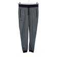 Unisex Under Armour - Dressikangast püksid, suurus 38 - Hall ()