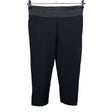 Unisex Free Quent - Mittevenivad poolpikad püksid, suurus 38 - Must ()