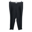 Unisex Voglia - Mittevenivad püksid, suurus 44 - Must ()