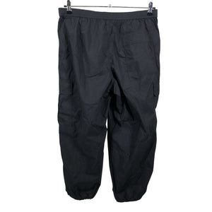 Unisex Uniqlo - Mittevenivad püksid, suurus 42 - Must (2)