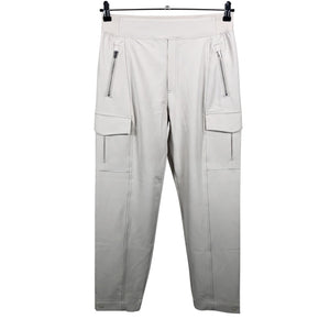 Unisex Athleta - Mittevenivad püksid, suurus 38 - Beige (1)