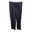 Unisex Aarrelabel - Mittevenivad püksid, suurus 40 - Must ()