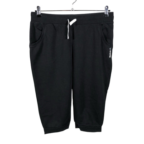 Unisex Reebok - Dressikangast poolpikad püksid, suurus 40 - Must ()