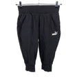 Unisex Puma - Trikotaažist poolpikad püksid, suurus 34 - Must ()