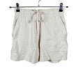 Unisex New Balance - Dressikangast lühikesed püksid, suurus 34 - Looduslik valge ()