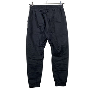 Unisex Nomen Nescio - Mittevenivad püksid, suurus 40 - Must (2)
