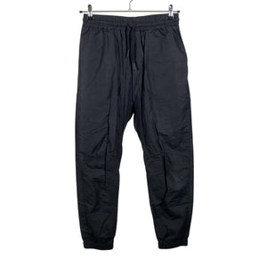 Unisex Nomen Nescio - Mittevenivad püksid, suurus 40 - Must (1)