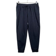 Unisex Nike - Dressikangast püksid, suurus 38 - Must ()