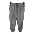 Unisex Nicole Miller - Mittevenivad püksid, suurus 40 - Hall ()