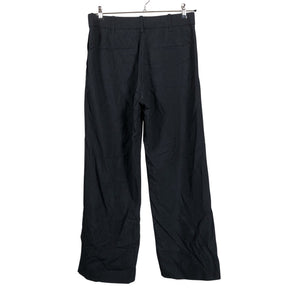 Unisex COS - Mittevenivad püksid, suurus 40 - Must (2)