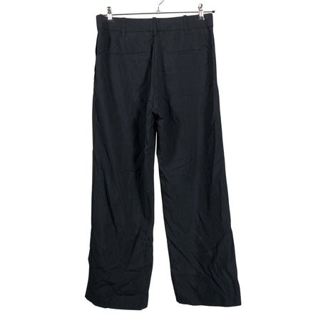 Unisex COS - Mittevenivad püksid, suurus 40 - Must (2)