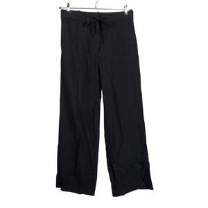 Unisex COS - Mittevenivad püksid, suurus 40 - Must (1)
