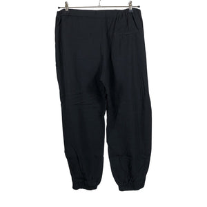 Unisex COS - Mittevenivad püksid, suurus 44 - Must (2)