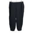 Unisex COS - Mittevenivad püksid, suurus 44 - Must ()