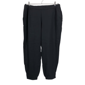 Unisex COS - Mittevenivad püksid, suurus 44 - Must (1)