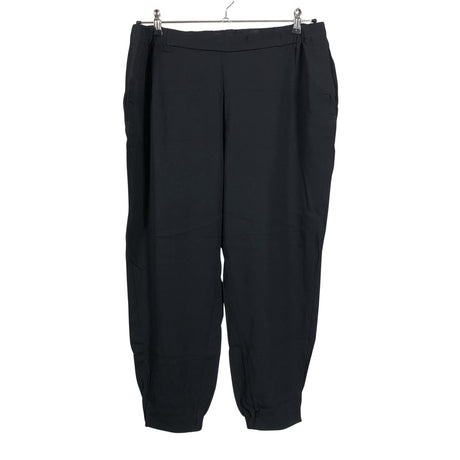 Unisex COS - Mittevenivad püksid, suurus 44 - Must ()