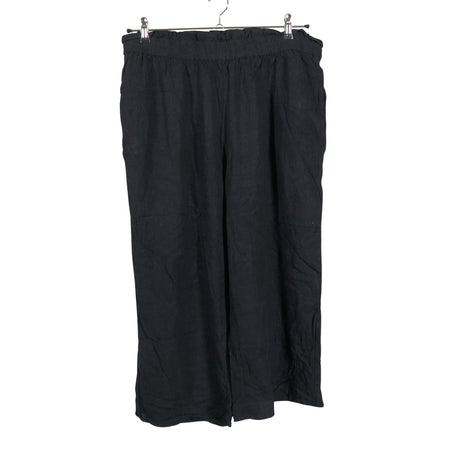 Unisex Cut & Pret - Mittevenivad püksid, suurus 48 - Must ()