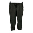 Unisex Noom - Mittevenivad püksid, suurus 40 - Roheline ()