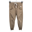 Unisex Torstai - Mittevenivad püksid, suurus 36 - Beige ()