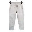 Unisex We - Mittevenivad püksid, suurus 128 - 134 - Beige ()