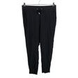 Unisex Lindex - Mittevenivad püksid, suurus 38 - Must ()