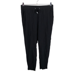 Unisex Lindex - Mittevenivad püksid, suurus 38 - Must (1)
