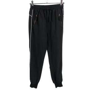 Unisex POMPdeLUX - Mittevenivad püksid, suurus 140 - 146 - Must (1)