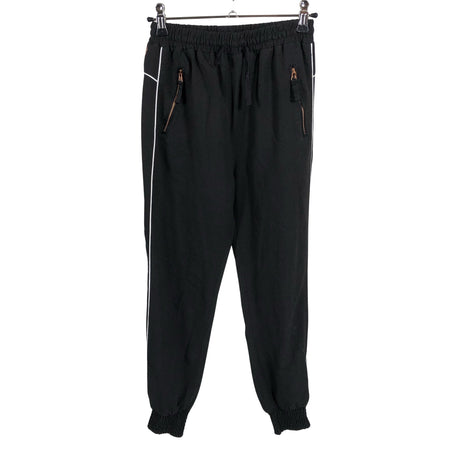 Unisex POMPdeLUX - Mittevenivad püksid, suurus 140 - 146 - Must ()