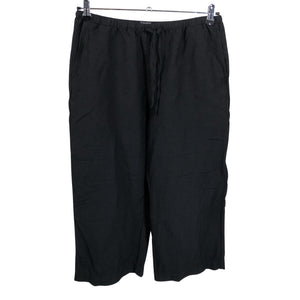 Unisex Lindex - Mittevenivad püksid, suurus 42 - Must (1)