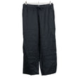 Unisex Arket - Mittevenivad püksid, suurus 40 - Must ()