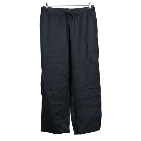 Unisex Arket - Mittevenivad püksid, suurus 40 - Must ()