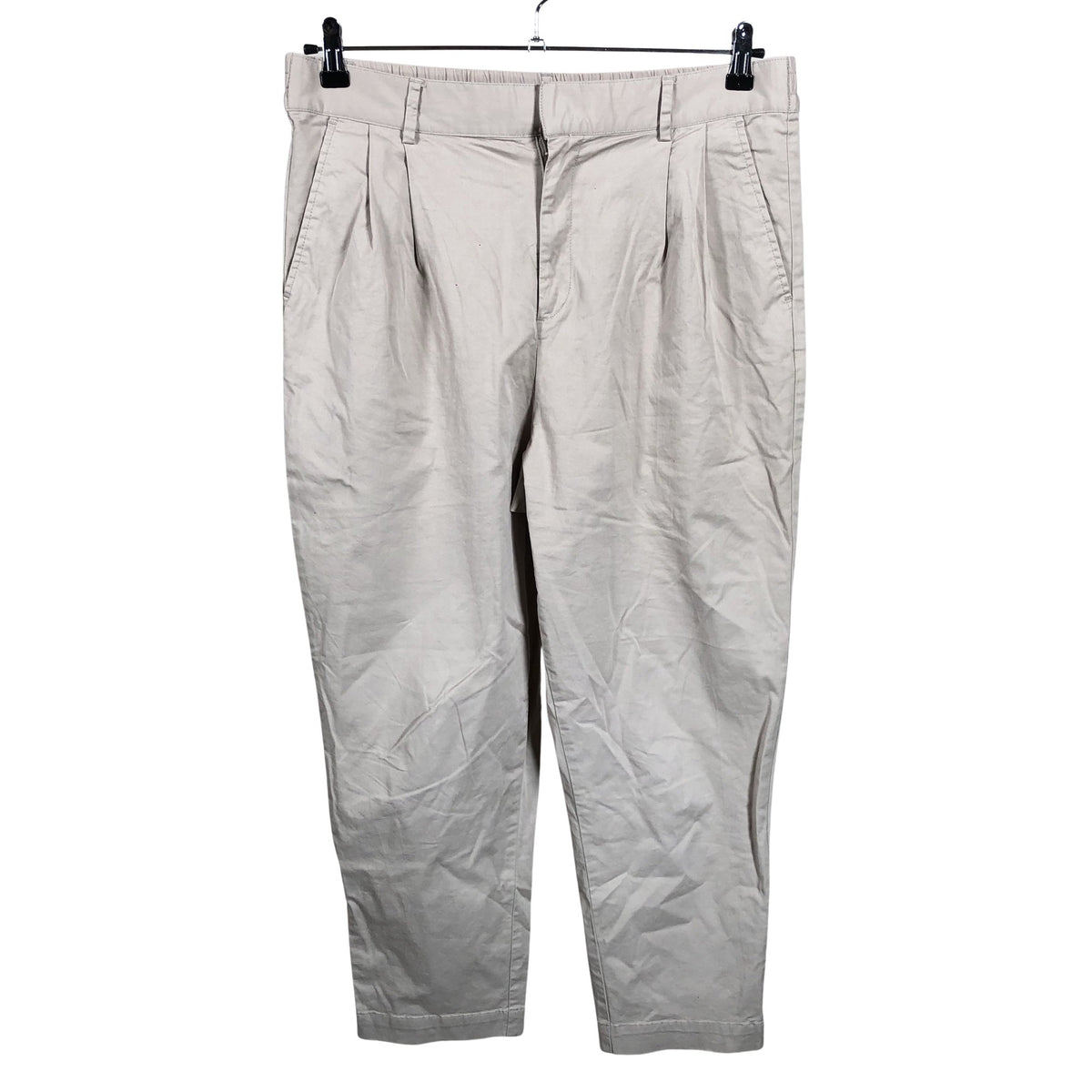 Unisex Noom - Mittevenivad poolpikad püksid, suurus 42 - Beige (1)