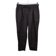 Unisex Voglia - Mittevenivad püksid, suurus 42 - Pruun ()