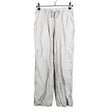Unisex Lindex - Mittevenivad püksid, suurus 140 - 146 - Beige ()