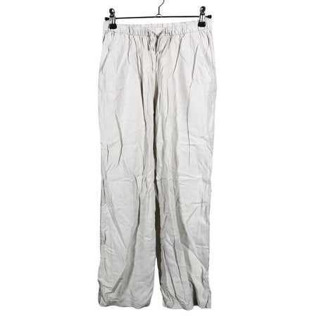 Unisex Lindex - Mittevenivad püksid, suurus 140 - 146 - Beige ()