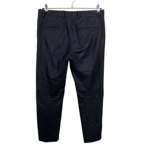Unisex COS - Mittevenivad püksid, suurus L - Must (2)