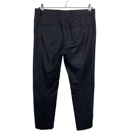 Unisex COS - Mittevenivad püksid, suurus L - Must (2)