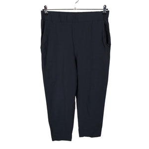Unisex COS - Mittevenivad püksid, suurus 40 - Must (1)