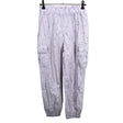 Unisex Lindex - Mittevenivad püksid, suurus 134 - 140 - Lilla ()