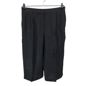 Unisex COS - Mittevenivad püksid, suurus 36 - Must (1)