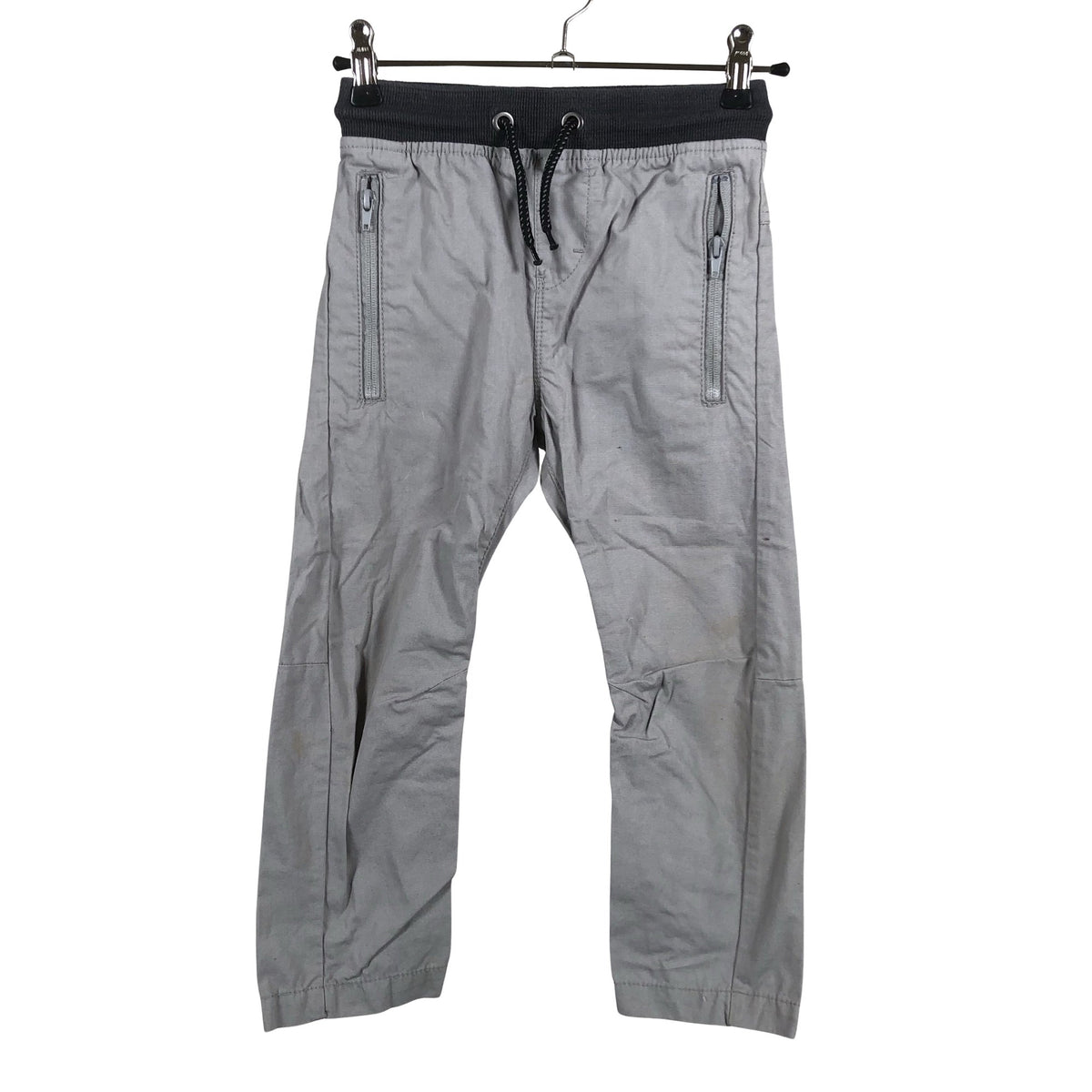 Unisex Next - Mittevenivad püksid, suurus 104 - 110 - Hall (1)
