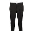 Unisex O.I.S - Mittevenivad püksid, suurus 40 - Must ()