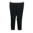 Unisex COS - Mittevenivad püksid, suurus 38 - Must ()