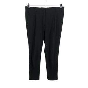 Unisex COS - Mittevenivad püksid, suurus 38 - Must (1)