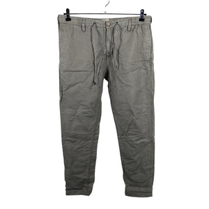 Unisex East West - Mittevenivad püksid, suurus W34 - Pruun (1)