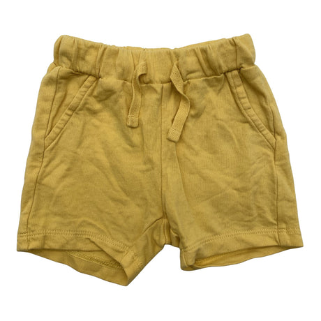Unisex Lindex - Trikotaažist lühikesed püksid, suurus 56 - 62 - Kollane ()