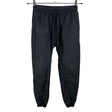 Unisex Nomen Nescio - Mittevenivad püksid, suurus 36 - Must ()