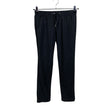Unisex Lindex - Mittevenivad püksid, suurus 158 - 164 - Must ()